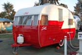 Very nicely restored red and white 1956 vintage shasta trailer